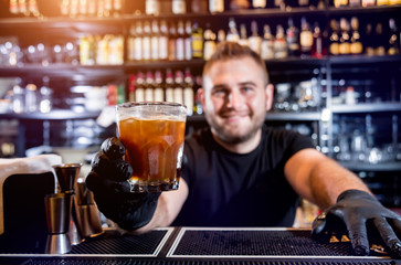 Bartender is making cocktail at bar counter. Fresh cocktails. 