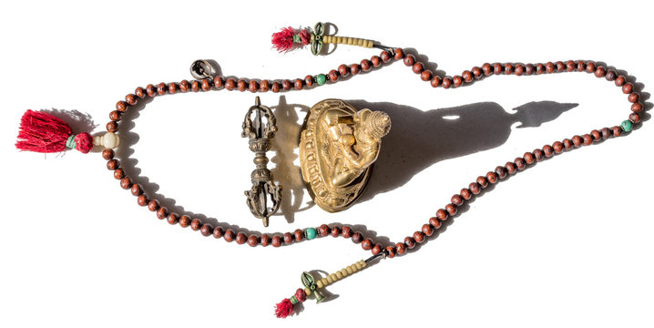Antique Tibetan Buddhist Prayer Beads on White Background with Brass Buddha