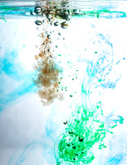 Fototapeta na wymiar Colored ink cloud grows in water. Astract shape background.