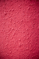 The texture of concrete painted red with a vignette on the edges. Background for the designer. Repair and interior