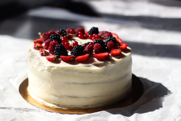 Home made cream cake with fresh strawberries, blackberries and currants