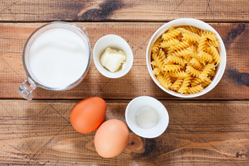 Step by step cooking pasta casseroles with eggs, step 1 - preparing the necessary ingredients, top view, selective focus