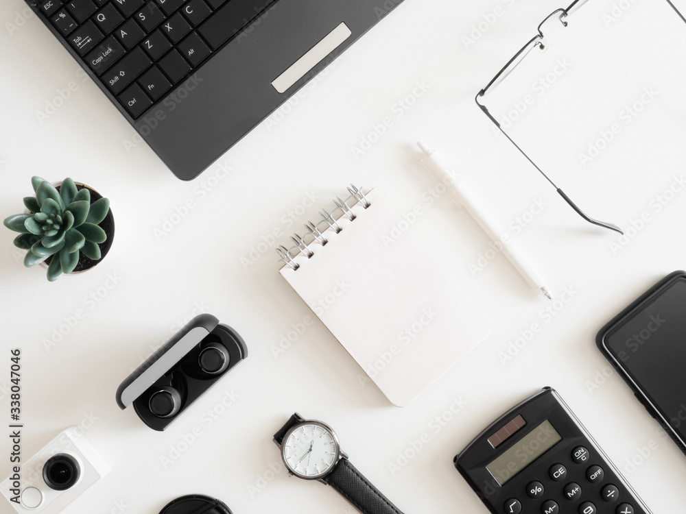 Poster top view of work from home concept with keyboard, calculator and notebook on white background, graph
