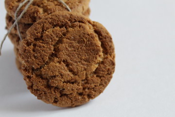 cookies round homemade close up near a stack of cookies that lie on top of each other on a white background