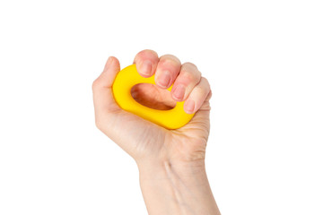Yellow and orange expander in woman hand isolated on white background.