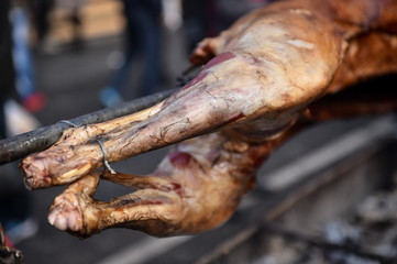 Lamb on the spit cooked on jar in a marketplace