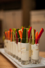 Cut vegetables in the sauce in the glass