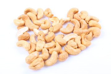 Fototapeta premium Roasted cashew nuts on white background
