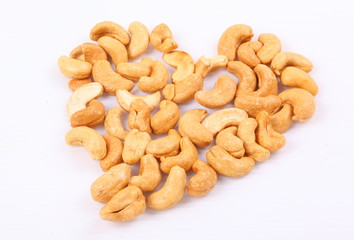 Roasted cashew nuts on white background