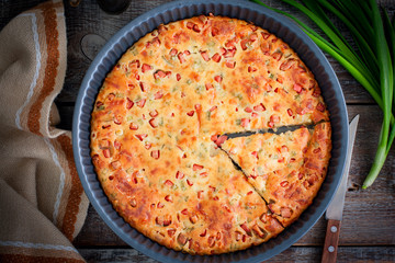 Pie with sausage, cheese and green onions, selective focus