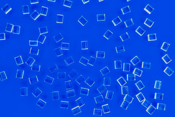 abstract plastic parallelepipedic shapes on a blue background