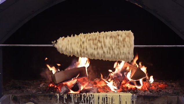 Sakotis - Lithuanian and Polish traditional branchy pastry cooked over an open fire on a rotating spit