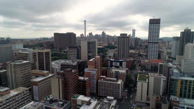 An aerial view of the Johannesburg skyline as seen from above Braamfontein on a moody, cloudy day. 