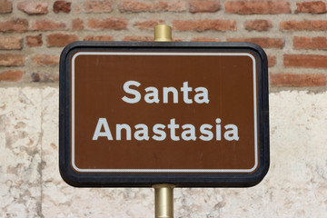 Fototapeta premium The Santa Anastasia sign at the entrance to the Basilica di Santa Anastasia in the old part of the city of Verona in Italy