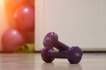 Dumbbells in gym. Fitness. Dumbbells one kilogram for yoga classes and fitness facilities. Morning exercises - yoga room.