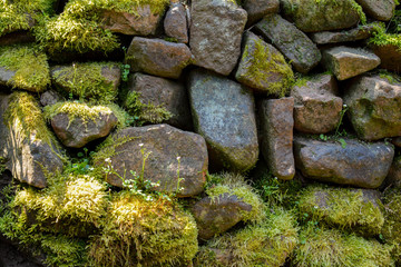 A old stone wall with moss