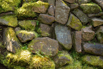 Old stone wall with moss