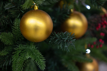 Obraz na płótnie Canvas a round ornamental ball of a house-decorated Christmas tree.