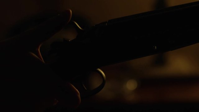 Close-up of a man finger cock, old gun. Filming on Red Cinema camera
