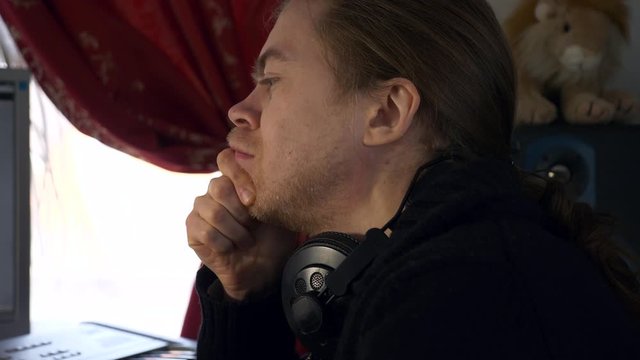 Young Musician Composer Experiencing Creativity Crisis while Writing Music. Frustrated Creative Person Lacking Ideas Emotion. 2x Slow motion 0.5 speed 60 FPS 4K