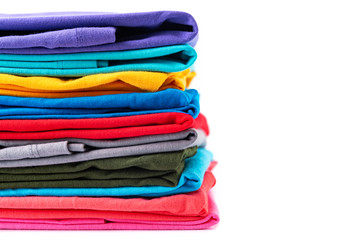 Stack of Colorful cotton T-shirt isolated on white background.