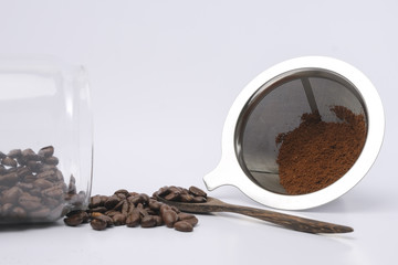 Coffee Beans And Ground Coffee on white background