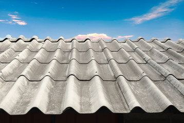 Old house roof With sky and clouds background