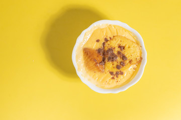 delicious custard in yellow and pink background