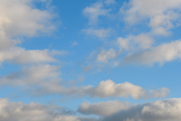 Blue sky with rare pre-storm clouds.