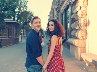 Young happy couple of lovers of love story. Man and woman together. Couple in love, walk around the...