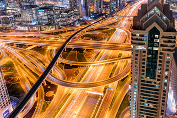 Fototapeta na wymiar Traffic at night in Dubai downtown 