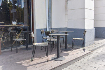 empty street cafe at the daytime in the central part of the city