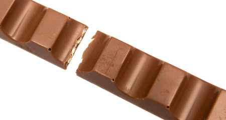 Broken chocolate bar isolated on a white background.