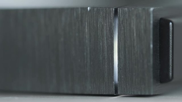 Macro Detail of External Hard Drive On a Table, Led Light Flickering - Solid Aluminium Casing HDD, Minimalist Design Composition 