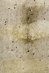 Warm yellow concrete texture with holes