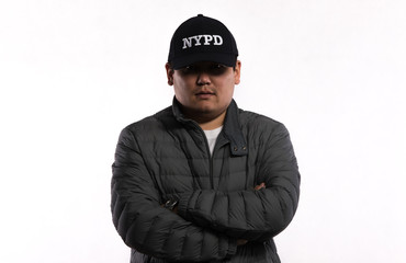 dark man portrait in a baseball cap on a white background