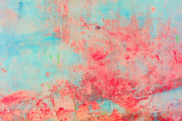 Old concrete wall covered with colorful paint