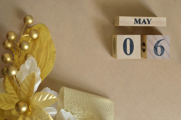 May 6, Vintage natural calendar design with number cube.