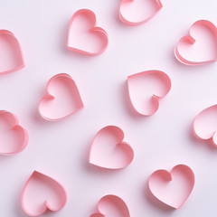 Pastel beauty texture made with paper hearts on white table. Abstract love background. Minimal Valentine's day concept