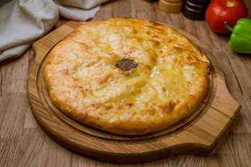 Ossetian pie with meat on board