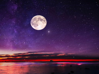  full moon on night starry sky at sea lilac pink sunset sky stars summer sea dark blue water reflection moonlight galaxy background nature © Aleksandr