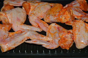 Homemade food grilled chicken wings in sauce