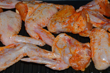 Homemade food grilled chicken wings in sauce