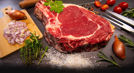 Raw T Bone steak entrecote prepared to Grill on turntable