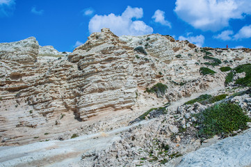 A fresh spring wind drives the waves to the coast of Cyprus. The Mediterranean Sea is painted with dark ultramarine and a luminous azure from the inside.     