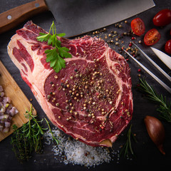 Raw T Bone steak entrecote prepared to Grill on turntable