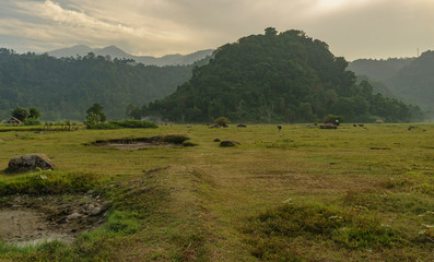 Nature scene farmers land near Rajabasa volcano mountain seen on a cloudy or hazy day near Kalianda