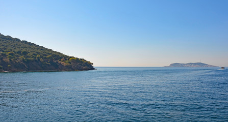 Fototapeta na wymiar Heybeliada, one of the Princes' Islands, also called Adalar, in the Sea of Marmara off the coast of Istanbul. Burgazada can be seen in the background 