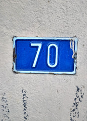 number seventy on a wall