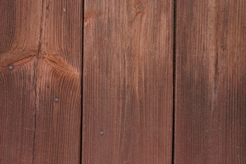 Old wooden boards nailed with rusty nails.